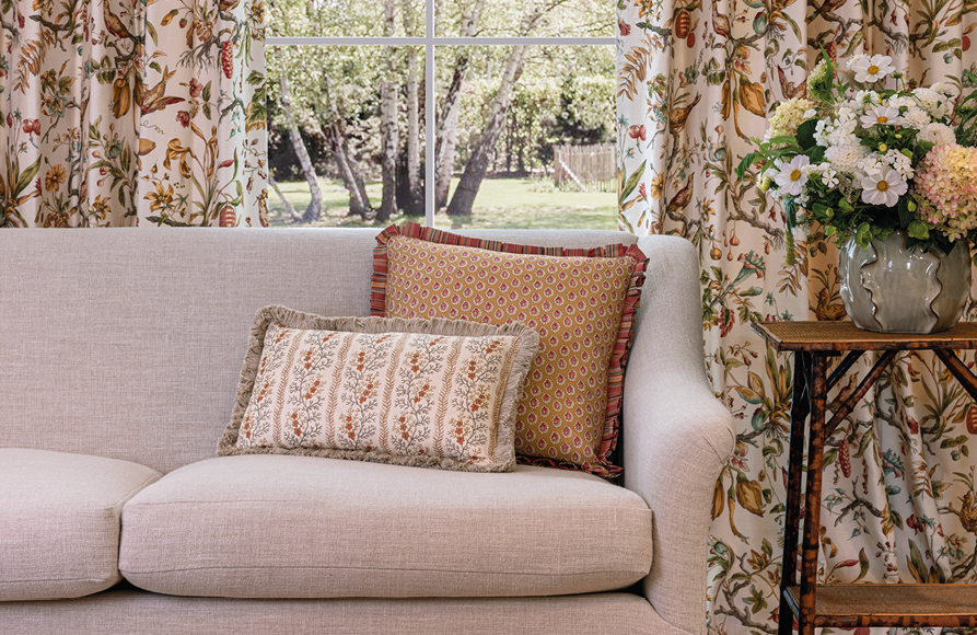 GP & J Baker floral curtains and cushions in a living room